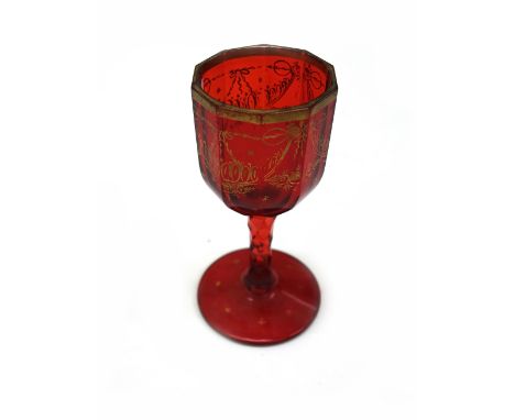 A set of eight Bohemian ruby drinking glasses, circa 1860, gilt with floral swags and stars, 14cm high and a George III style