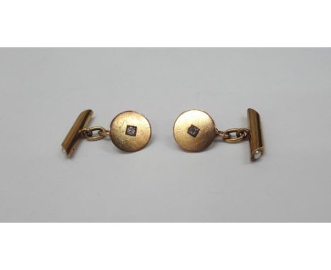 A pair of gold and diamond circular panel cufflinks with cultured pearl set bar terminals, unmarked, 4.7g gross.