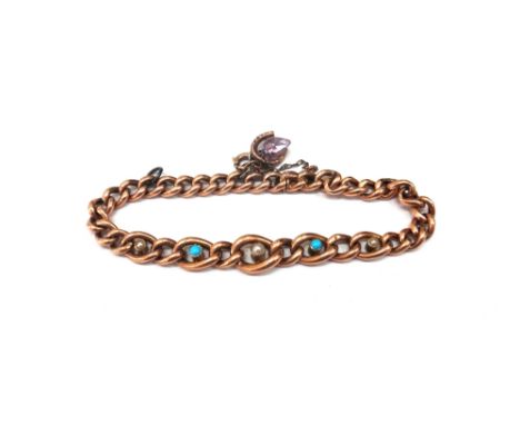 A gold seed pearl and cabochon turquoise curb link bracelet with integral clip, detailed '15ct' with two pendant charms, 14.4