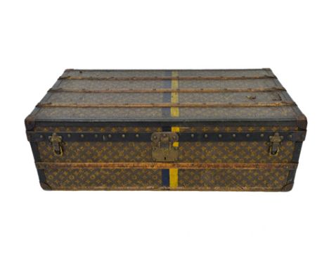 A Louis Vuitton monogram trunk, no.210906, with wooden battens, metal bound, with side carrying handles, lift out interior tr