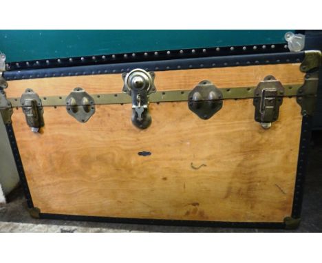An Overpond wooden trunk with studded bandings, 91 x 51 x 52cm and a blue fibre trunk, 91 x 51 x 35cm, both with keys, (2). 