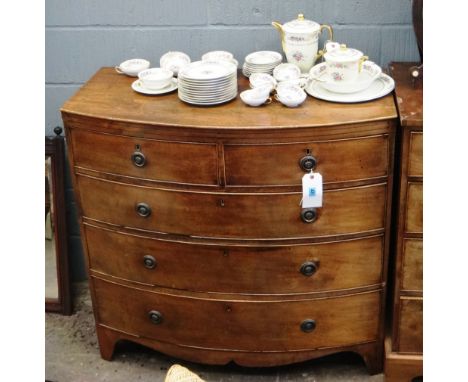 A George III mahogany bow fronted chest, fitted with two short and three long drawers, on a shaped apron stand, 105.5cm wide.