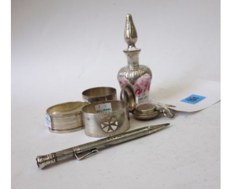 An Edwardian silver sovereign case, Birmingham 1906, monogrammed, an engine turned silver propelling pencil, Samson Mordan & 