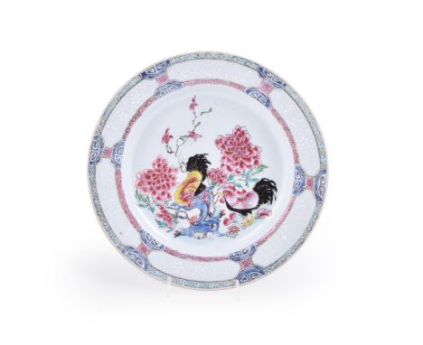 A fine Chinese porcelain famille rose double cockerel plate, Qianlong, with peony and rockwork, enclosed within a bianco sopr