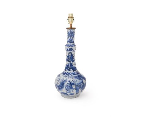 A Chinese blue and white bottle vase, Chongzhen, circa 1640, painted with figures attending an official, the scene is set wit