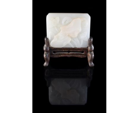 A Chinese white jade 'Lotus' plaque, Qing Dynasty, 18th or 19th century, approximately 6cm high x 7cm wide x 1cm deep, wood s