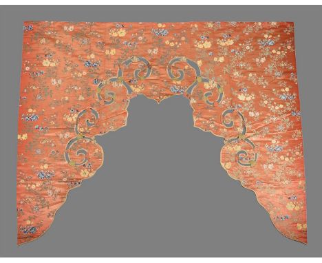 A Chinese orange silk brocade pelmet, Qing Dynasty, with a scrolling edge made to frame a large statue or a door way, the sil