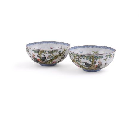 A fine pair of Chinese eggshell porcelain bowls, Republican Period, the interiors painted with butterflies, the exteriors bri