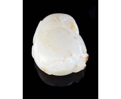 A fine Chinese white and russet jade snuff bottle, Qianlong, well hollowed, carved on each side with a large peach issuing fr