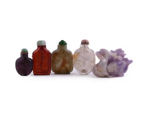 Four Chinese snuff bottles, Qing Dynasty, comprising: a celadon jade and russet 'pebble' bottle, carved with a sage and boy u