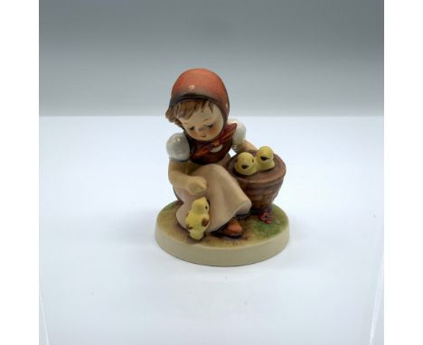 Hand-painted figurine depicting a young girl with a basket of baby chickens. Goebel backstamp on the bottom. Artist: Reinhold