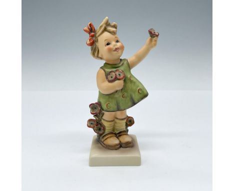 Hand painted porcelain figurine depicting a sweet young girl with a cheerful smile offering a poppy flower. Goebel TMK6. Arti