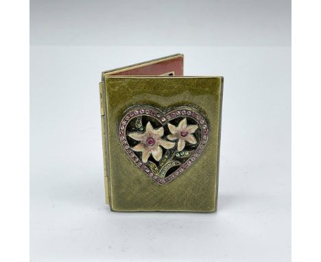 Exquisite folding frame, embellished with sage green enamel, features a crystal-encrusted heart adorned with two champagne-co