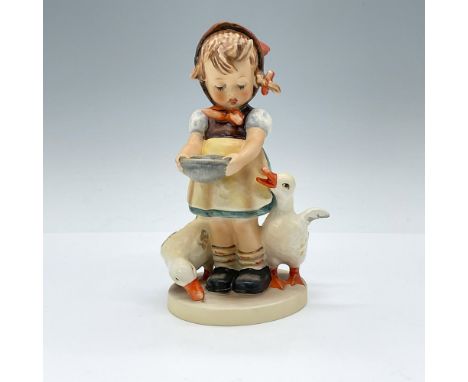 Hand painted porcelain figure depicting a young girl feeding some impatient ducks. Goebel TMK5. Issued: 1972-1979Dimensions: 