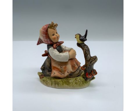 Hand-painted figurine depicting a young girl and a small bird singing. Goebel backstamp on the bottom. Artist: Gerhard Skrobe