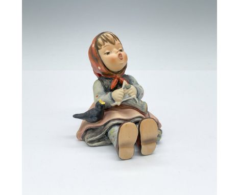 Hand-painted porcelain figurine of a sitting girl knitting with a bird by her side. Goebel TMK6. Issued: 1979-1990Dimensions: