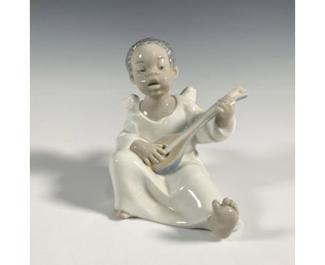 A glossy figure of an angel playing a guitar. Lladro backstamp. This item has its original box: 8"L x 5.5"W x 5"H. Artist: Fu