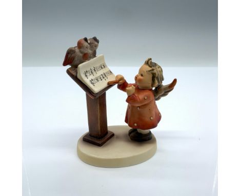 Hand-painted figurine depicting a young girl conducting two birds singing a duet. Goebel backstamp on the bottom. Dimensions: