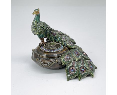 Stunning peacock-shaped treasure box featuring a majestic peacock standing amidst vibrant green, purple, violet, and blue hue