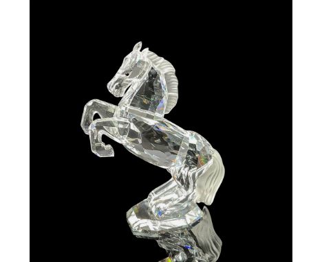 Part of the Horses on Parade collection. Clear crystal body with a frosted crystal tail and mane and jet eyes. Swarovski back