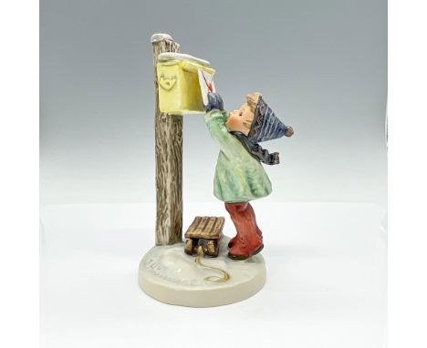 Hand-painted porcelain figurine depicting young boy excitedly posting his letter to Santa. Goebel TMK5. Issued: 1972-1979Dime