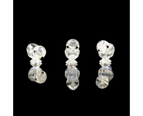 A set of three clear crystal chicks that have black crystal eyes and frosted beaks. Swarovski backstamp. This item has its or
