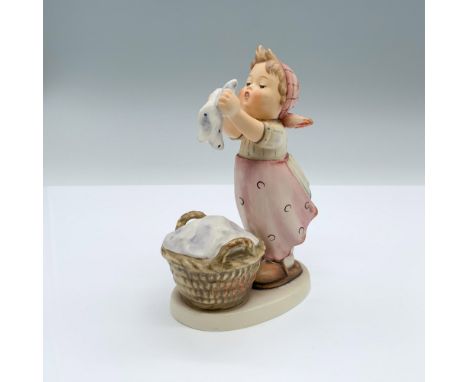 Hand-painted figurine depicting a young girl with a laundry basket. Goebel backstamp on the bottom. Issued: 1957Dimensions: 3