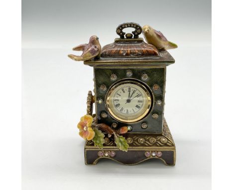 Handmade enameled metal clock adorned with birds and flowers and accented with rhinestones throughout design. Jay Strongwater