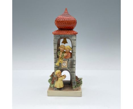 Hand-painted porcelain figurine depicting angels in the clock tower calling others to worship. Goebel TMK6. Issued: 1979-1990