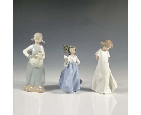 Three porcelain figures in glossy finish; depicts a girl with pigtails holding two kittens, So Shy depicting young girl with 