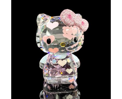 Fun faceted crystal figure of Hello Kitty with a pink bow encrusted with pink and clear crystals. Swarovski mark. Item number