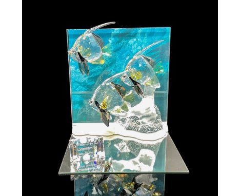 Beautiful representation of the ocean with crystal tropical fishes colored in yellow, and black set on frosted coral reef. Si