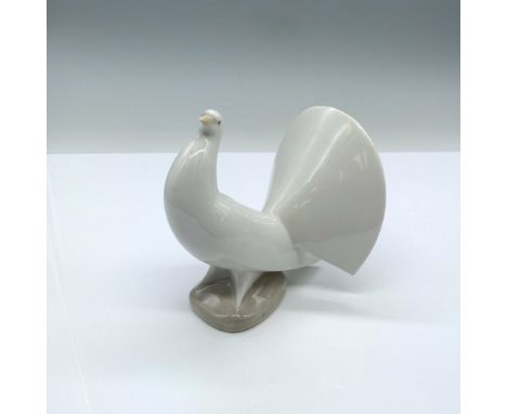 Glossy finish; Nao by Lladro backstamp on the bottom. Dimensions: 5"L x 3.75"W x 4.75"HManufacturer: Nao by LladroCountry of 