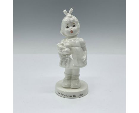 Part of the M.I. Hummel Society this white figurine is only painted on her face. She is depicted holding a bunch of flowers w