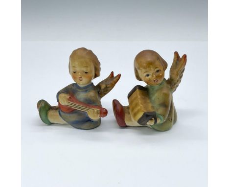Two adorable porcelain angels playing musical instruments. Both have a receptacle for a small candle. Hand painted. Goebel ba