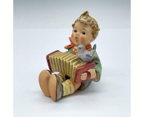 Hand painted porcelain boy with accordion, matte finish. Goebel TMK6. Artist: Reinhold UngerIssued: 1979-1990Dimensions: 3"L 