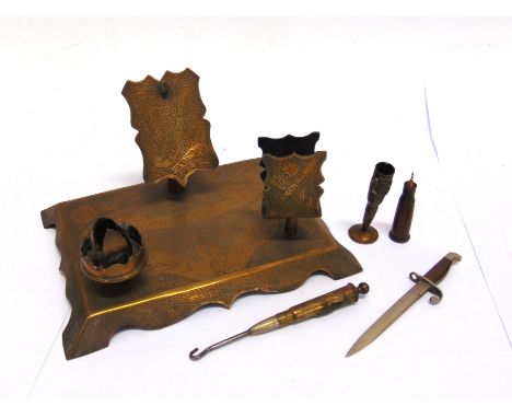 GREAT WAR - A TRENCH ART ENGRAVED BRASS DESK STAND with watch stand, matchbox holder and candle stick, decorated with floral 