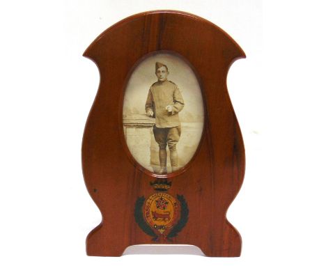 GREAT WAR - A BLONDE WOOD 'GORNINGREN' SERPENTINE SHAPED PHOTOGRAPH FRAME  bearing the painted device of the York & Lancaster