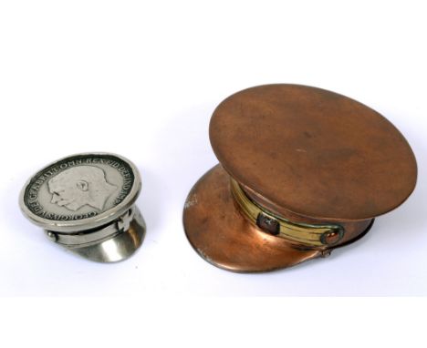 GREAT WAR - A COPPER AND BRASS TRENCH ART SNUFF BOX IN THE FORM OF A PEAKED CAP  with hat-band, and hinged base for snuff, 6.