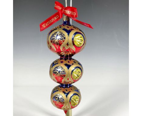 Handcrafted ornament featuring a descending spherical design with vibrant blue, red, and gold accents. Each of the three stac