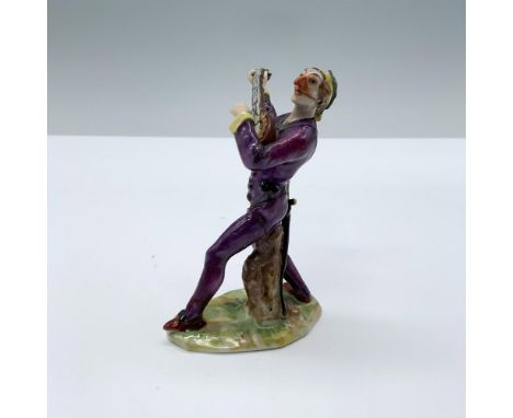 Hand painted porcelain depicting a musician in a purple costume playing a string instrument. Marked N from Capodimonte. Dimen