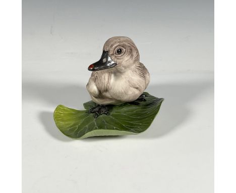 Vintage hand-painted porcelain depiction of a young swan seated on a lily pad. Boehm stated that he loved working with porcel