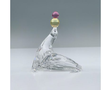 Part of the Cheerful Times series. Clear crystal figural with jet inset eyes, balancing yellow and pink crystal balls. Swarov