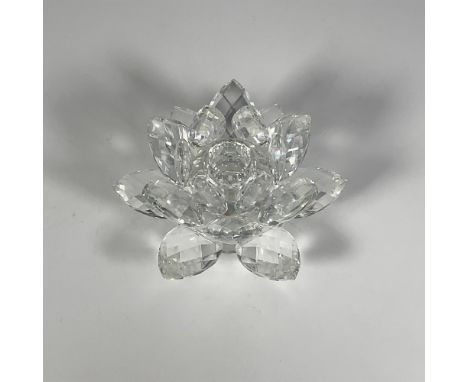 Faceted clear crystal candleholder featuring a beautiful blossoming waterlily. Swarovski etched backstamp. Issued: 21st centu