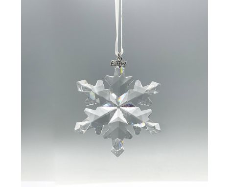 Gorgeous limited edition clear crystal ornament, featuring a six pointed snowflake with an intricate crystal cut design. This