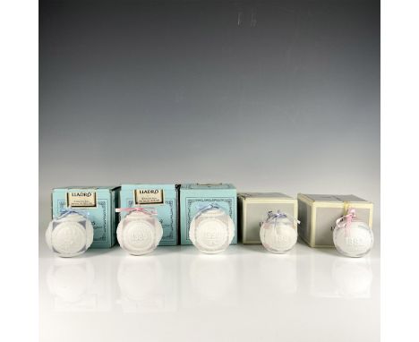 Joyful collection of annual Christmas ball ornaments from 1988 to 1992, featuring intricate designs and serene, dreamy pastel