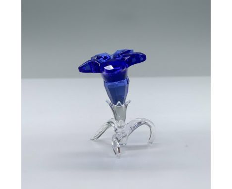 Beautiful standing blue flower with bright yellow middle and crystal clear base. Swarovski swan mark. This item has its origi