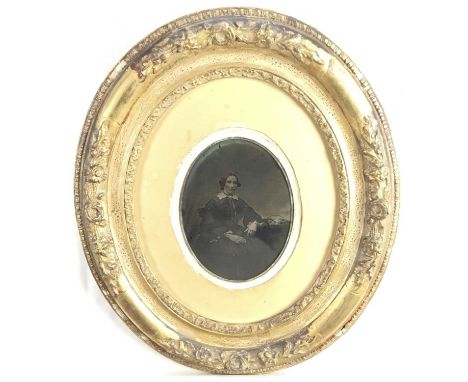 Pair of Edwardian embossed brass photograph frames containing period photographic portraits, 31cm x 21cm, together with a Vic