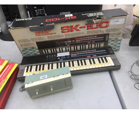 A RETRO PHILIPS CLOCK RADIO AND AN SK-100 KEYBOARD 