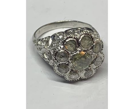 AN 18 CARAT WHITE GOLD DIAMOND CLUSTER RING WITH A CENTRE AND EIGHT SURROUNDING DIAMONDS GROSS WEIGHT 5,4 GRAMS SIZE O/P WITH